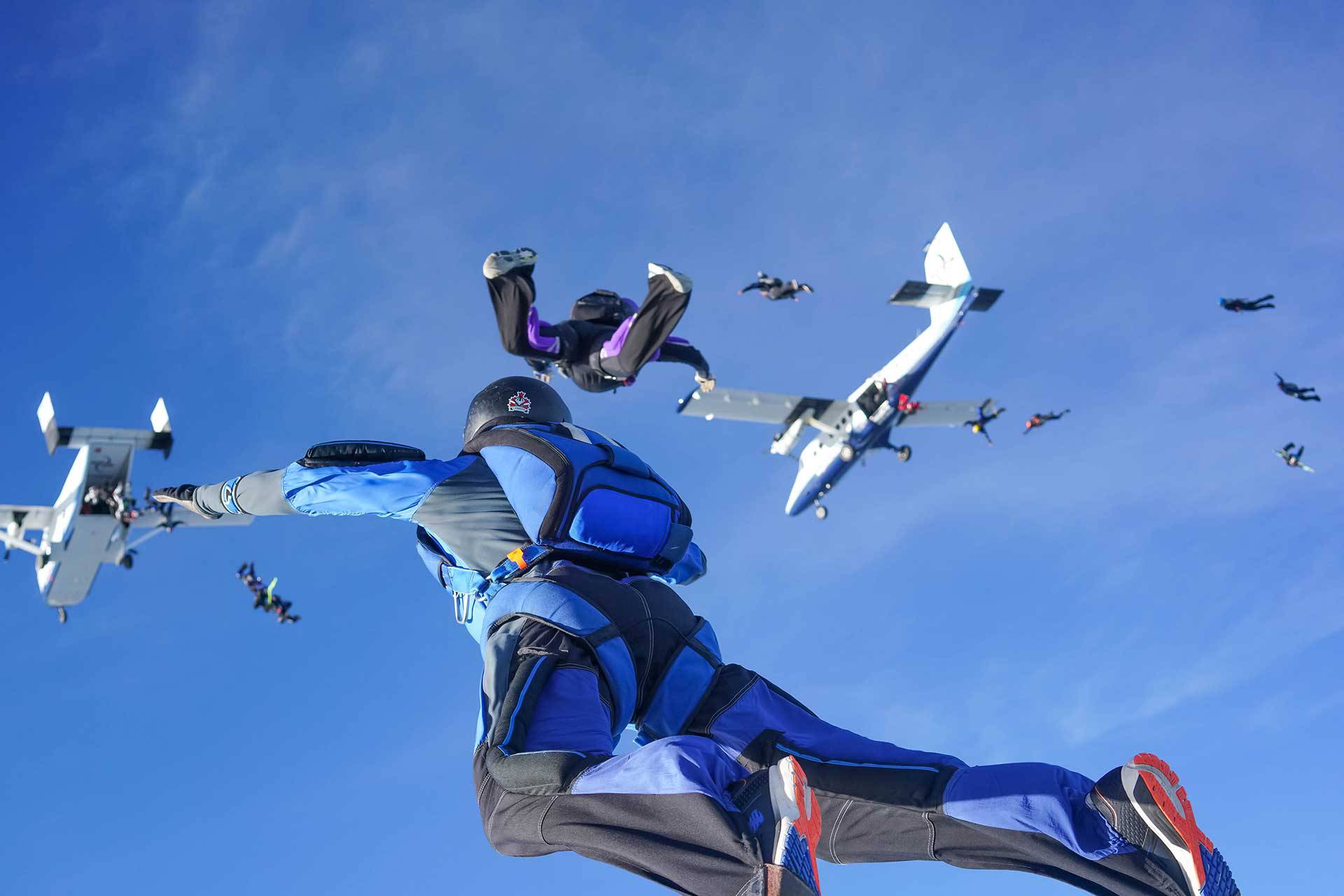 Multiple fun jumpers in freefall after exiting several aircraft